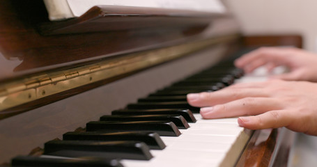 Fototapeta premium Man practice piano at home