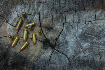 A set of bullets on a wood background,There is extra space for added text