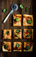 Homemade pizza with  tomatoes, basil and mozzarella