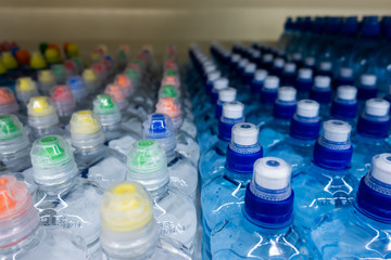 PET Bottles. Image of many plastic bottles with water in a shop. plastic bottles with drinking water top view. 
