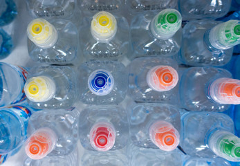 PET Bottles. Image of many plastic bottles with water in a shop. plastic bottles with drinking water top view. 