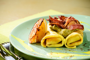 Delicious pancake blinis with bacon and mustard sauce with copyspace. New restaurant menu for the holiday Maslenitsa