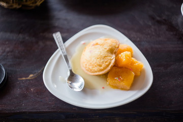 Deep fried a mango ice cream with mango jam