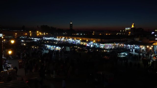 Famous Jemaa el Fna square crowded after sunset, Marrakesh, Morocco, timelapse 4k