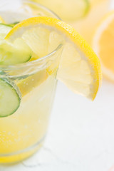 Sassy detox water with lemons, cucumbers and ginger. Healthy breakfast.