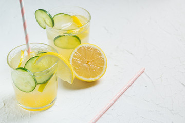 Sassy detox water with lemons, cucumbers and ginger. Healthy breakfast.