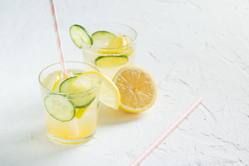 Sassy detox water with lemons, cucumbers and ginger. Healthy breakfast.