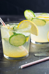 Sassy detox water with lemons, cucumbers and ginger. Healthy breakfast.