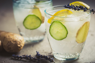 Sassy detox water with lemons, cucumbers and ginger. Healthy breakfast.