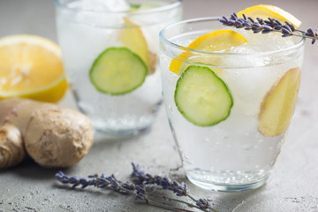 Sassy detox water with lemons, cucumbers and ginger. Healthy breakfast.