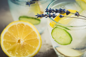 Sassy detox water with lemons, cucumbers and ginger. Healthy breakfast.