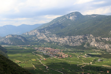 Fototapeta na wymiar Townscape of village Dro with mountain panorama near Lake Garda, Italy