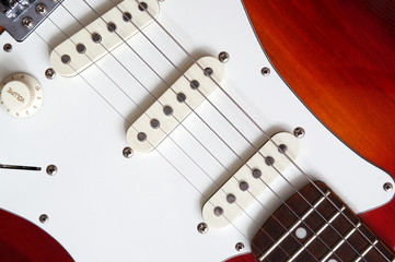 red electric guitar with a white deco