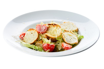 New menu in the restaurant. Appetizing salad with chicken, tomatoes and toastes isolated on white background