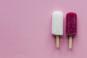 pink and white summer ice lollies on a pink background
