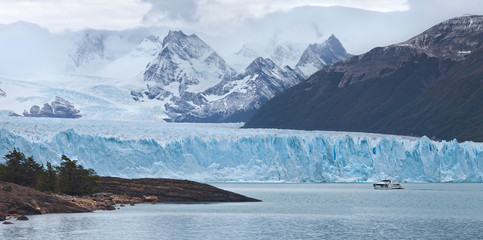 Ship with tourists on lake near Perito Moreno Glacier, Los Glaciares National Park in Santa Cruz Province, Argentina, Patagonia.
