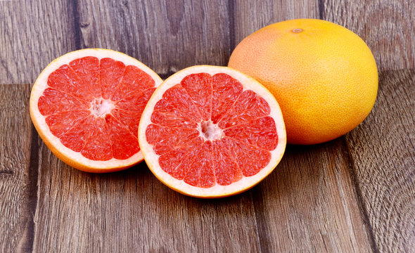 Colorful of grapefruit on wooden background