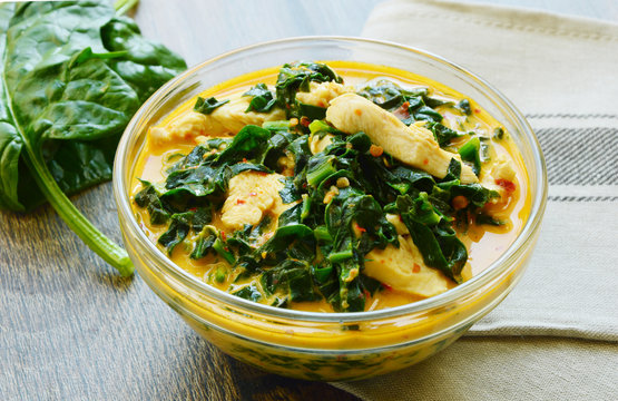 Spinach and chicken breast  with curry and coconut soup Thai menu