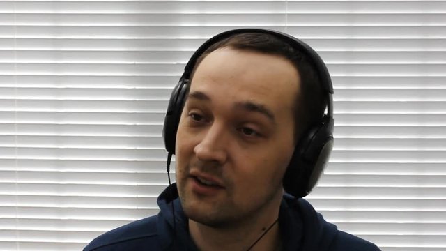 
Man closeups singing song in the headphones
