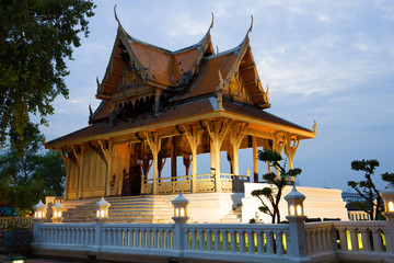Ancient wooden Buddhist temple in the evening twilight. Bangkok, Thailand