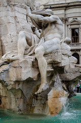 the four river fountain, detail of the four rivers fountain in Navona Square.  Nile river metaphor. Rome, Italy