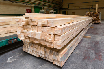 Stack of pile wood bar in lumber yard factory used in wood-processing industry