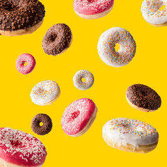 donuts fall on a yellow surface