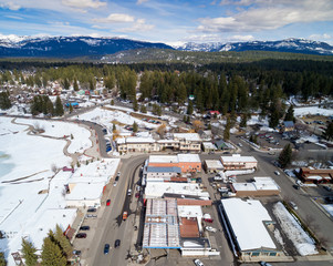 Fototapeta na wymiar Aerial view of McCall Idaho in winter with mountain range backdrop