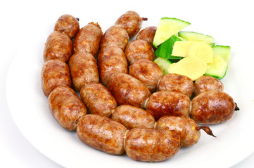 Easten thai sausage (Thai name is Sai Krok Isan) on white background.  ground pork with vermicelli,Rice and garlic  Sausage © posinote