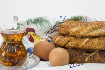 Simit (Turkish bagel) isolated on white background . Tea concept with bagel .