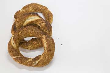 Simit (Turkish bagel) isolated on white background . Tea concept with bagel .
