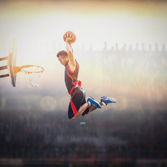 Basketball Player scoring an athletic, action slam dunk