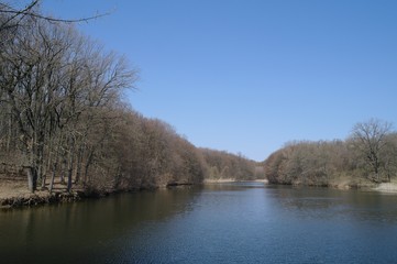Fototapeta na wymiar Spring landscape, pond, river, trees, sky.