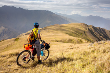 Mountain biker is travelling in the highlands of Tusheti region, Georgia - 199723174