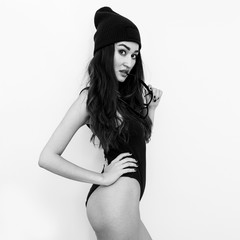 Naklejka premium Hipster Girl in fashion beanie cap and black body. Swag style