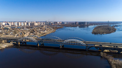 Aerial view of the Kiev city, Ukraine. Dnieper river with bridges. Darnitskiy bridge