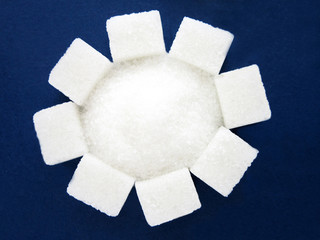 sugar cubes on a blue background.health.diabetes.