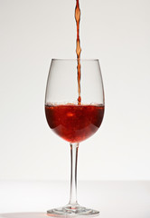 Close-up of pouring red wine