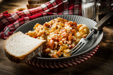 Scrambled eggs with sausage.