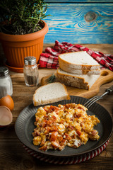 Scrambled eggs with sausage.