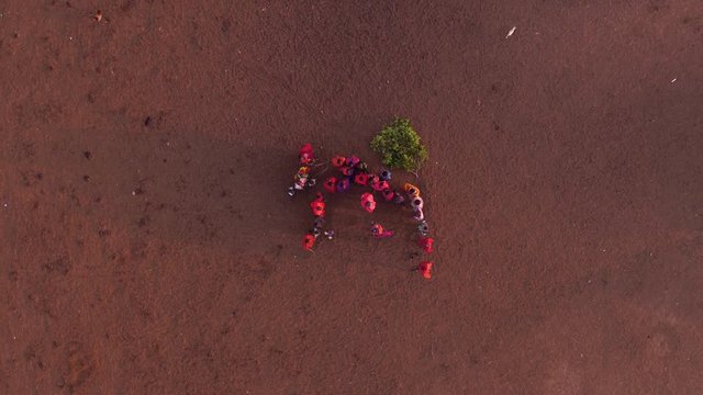 Aerial of local people in a Maasai village