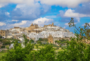 Fototapeta premium Ostuni (Puglia, Italy) - The gorgeous white city in province of Brindisi, Apulia region, Southern Italy, with the old historic center on the hill and beside the sea