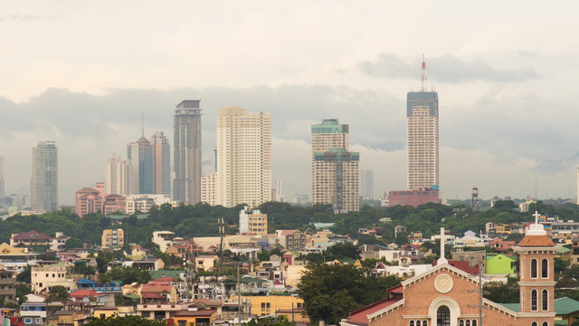 Manila skyscrapers in the cloudy evening. Philippines.