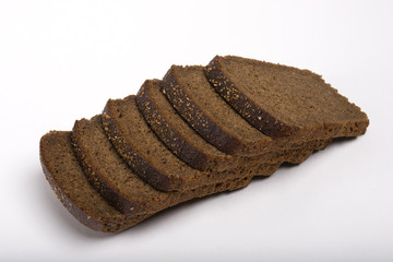 Brot. Grain Food Group. Black bread. Type of bread on top. Sliced bread on a white background.
