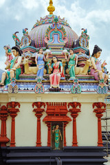 The Sri Mariamman Hindu Temple in Chinatown, Singapore. Fragment of decoration with painted figures of Hindu gods and deities.