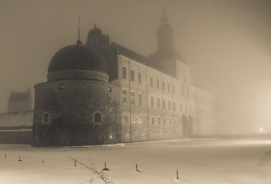 Fototapeta Black and white image of an old castle in fog