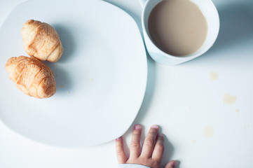 White plate of sweet croissants and coffe