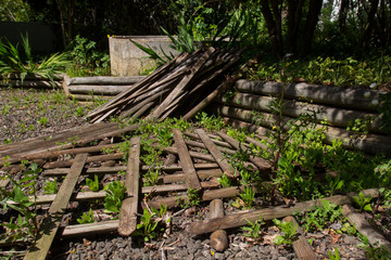 wood fence fallen in a garden