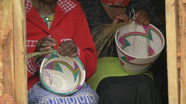African women crafting traditional baskets