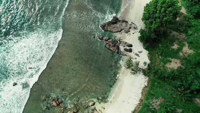 Aerial footage of tropical Nampu beach, South Yogyakarta, Indonesia - March, 2018